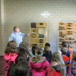 Students look at samples of old pipes